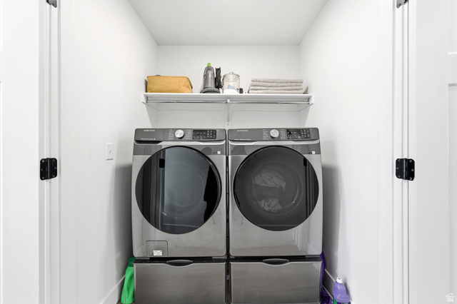 4646 Alder Drive, Unit 223 Mapleton, UT 84664 - Photo 17 of 35 Dedicated laundry area with white walls and a wire shelf