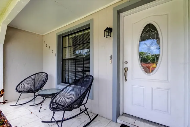 a view of livingroom with furniture and wooden door