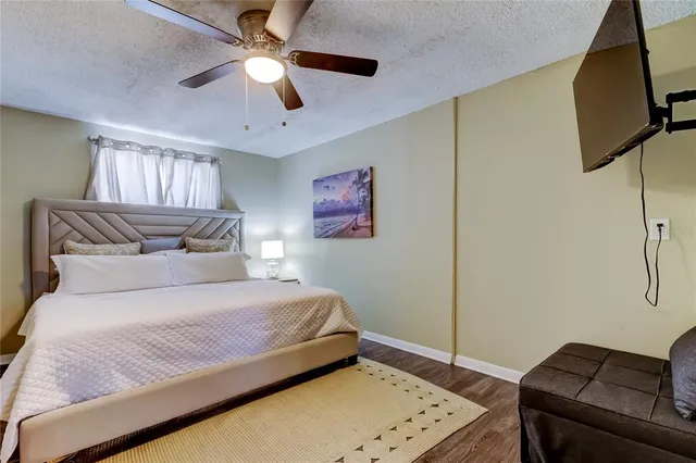 a bedroom with a bed and a couch