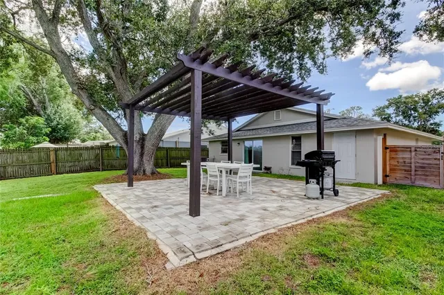 a view of a backyard with a patio