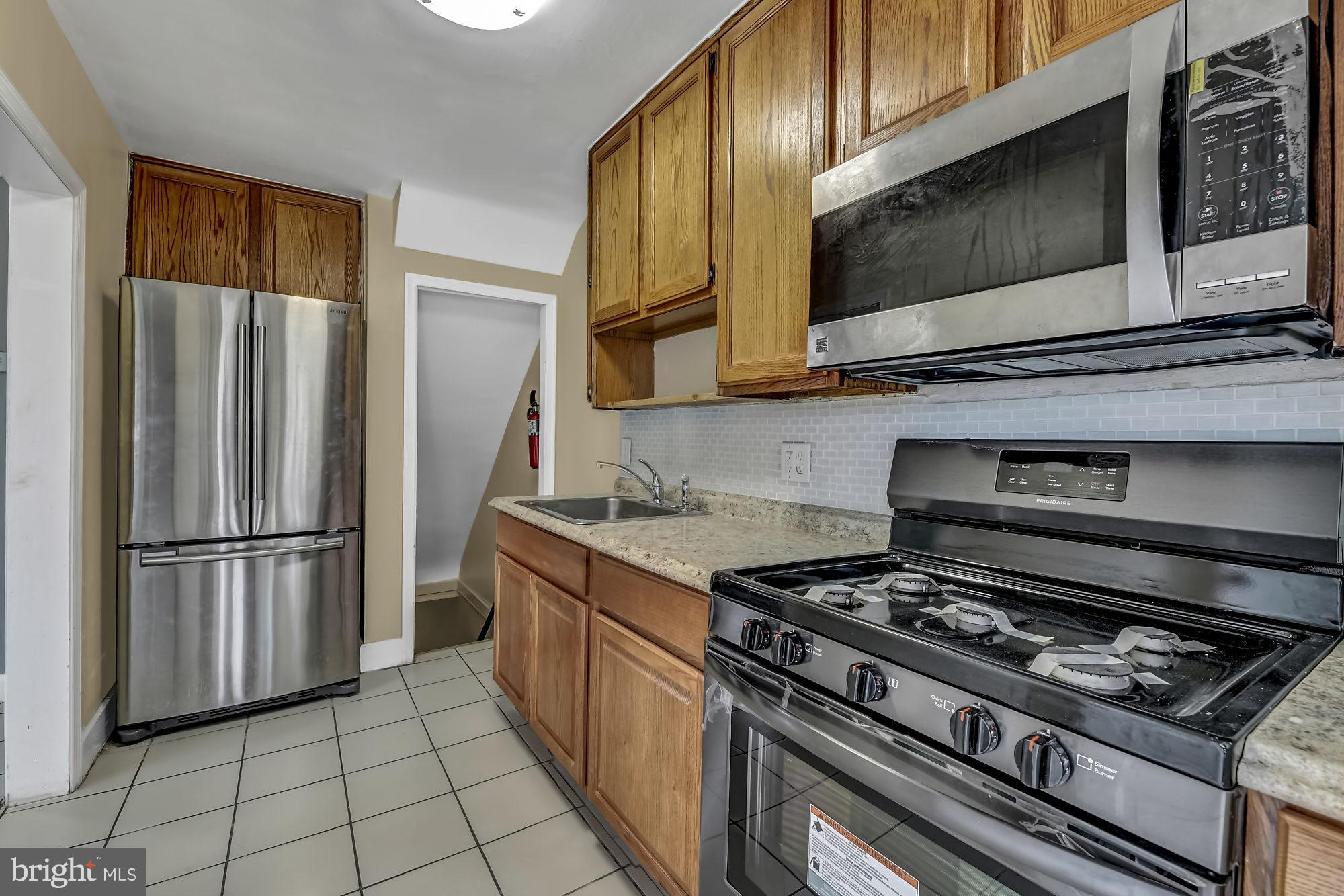 7921 Kavanagh Road Baltimore, MD 21222 - Photo 11 of 28 Kitchen looking into lower level stairway