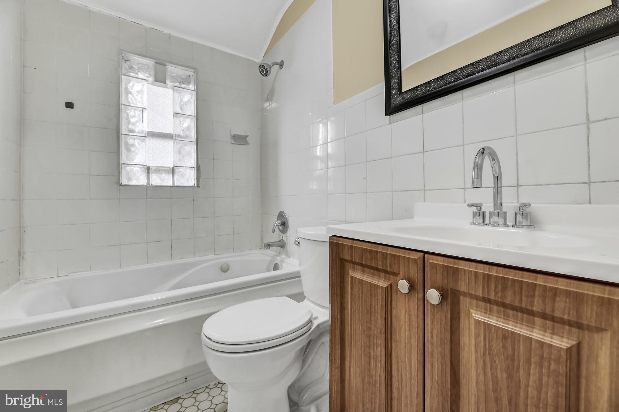 7921 Kavanagh Road Baltimore, MD 21222 - Photo 19 of 28 Upper level full hall bathroom