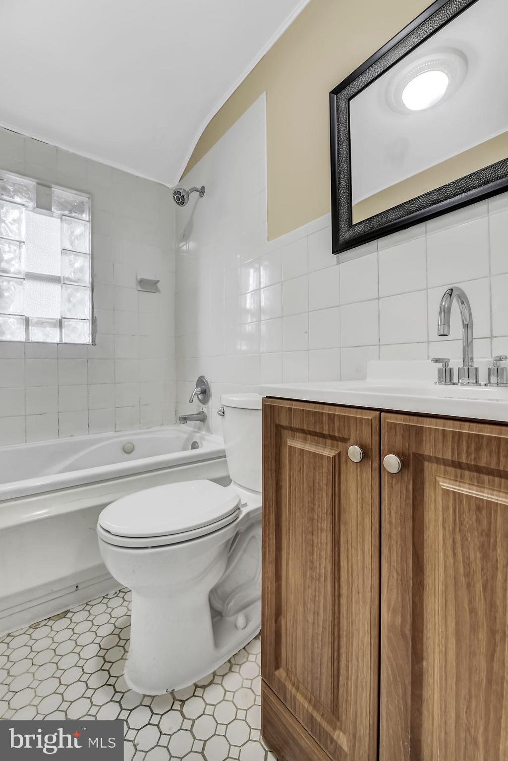 7921 Kavanagh Road Baltimore, MD 21222 - Photo 20 of 28 Upper level full hall bathroom