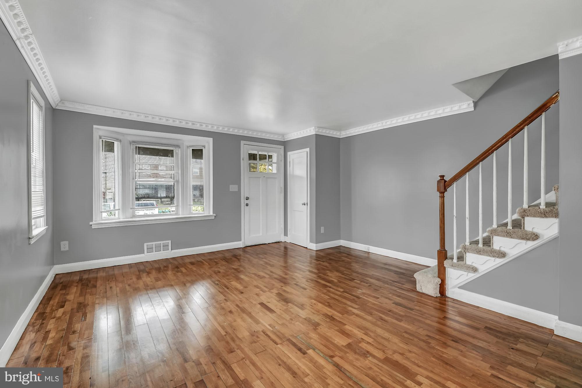 7921 Kavanagh Road Baltimore, MD 21222 - Photo 4 of 28 Living room with bay windows