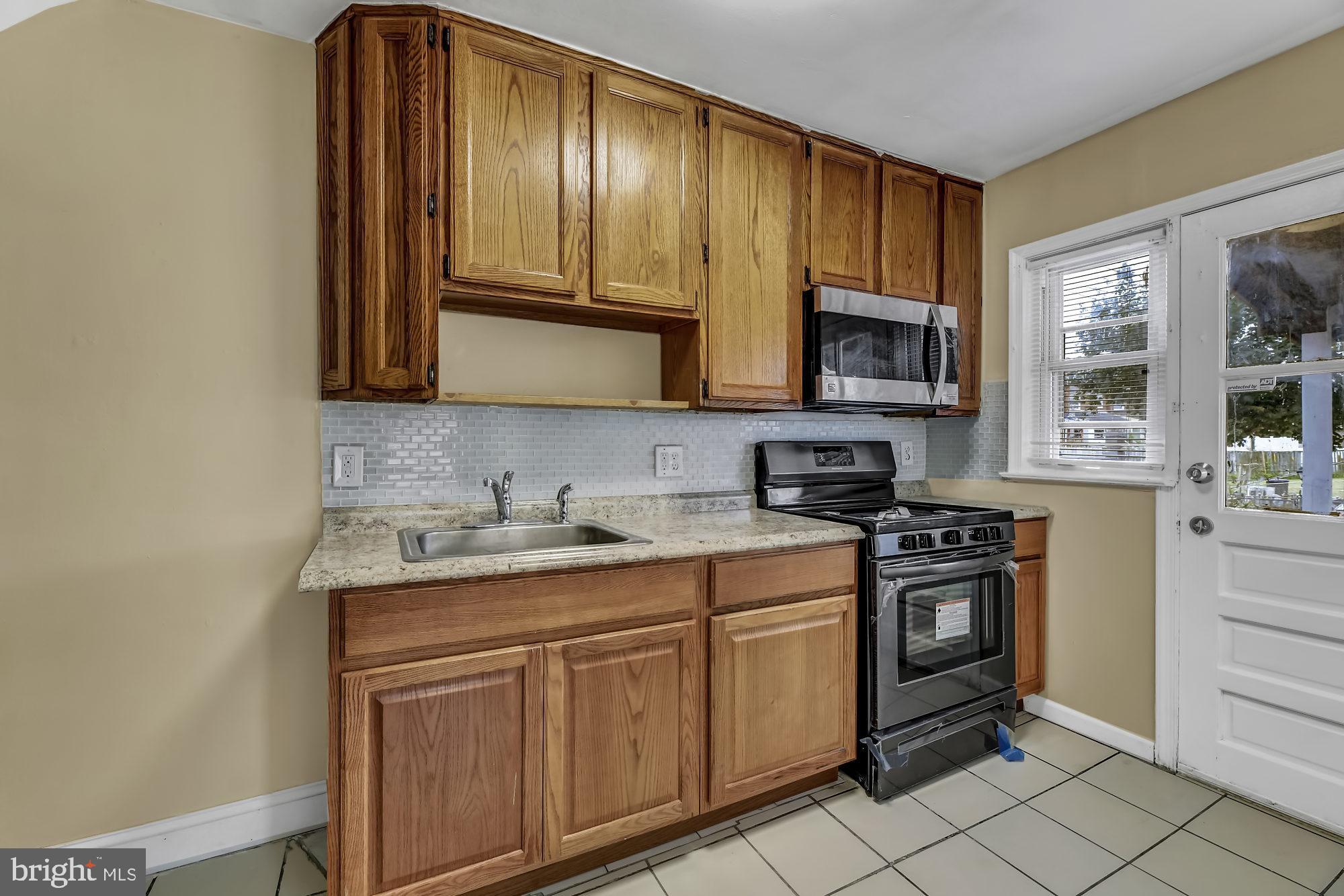 7921 Kavanagh Road Baltimore, MD 21222 - Photo 9 of 28 Kitchen with fresh paint and updated countertops
