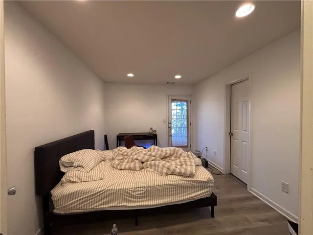 a bedroom with a bed and window
