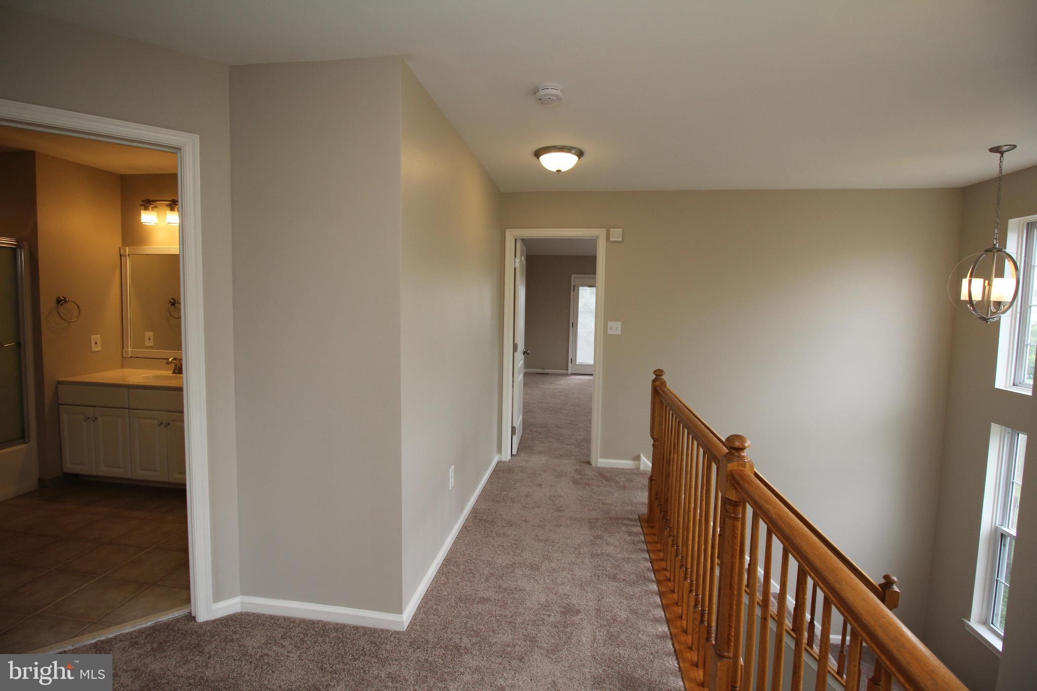 121 Wilson Lane Berlin, NJ 08009 - Photo 35 of 59 a view of a hallway with wooden floor and closet