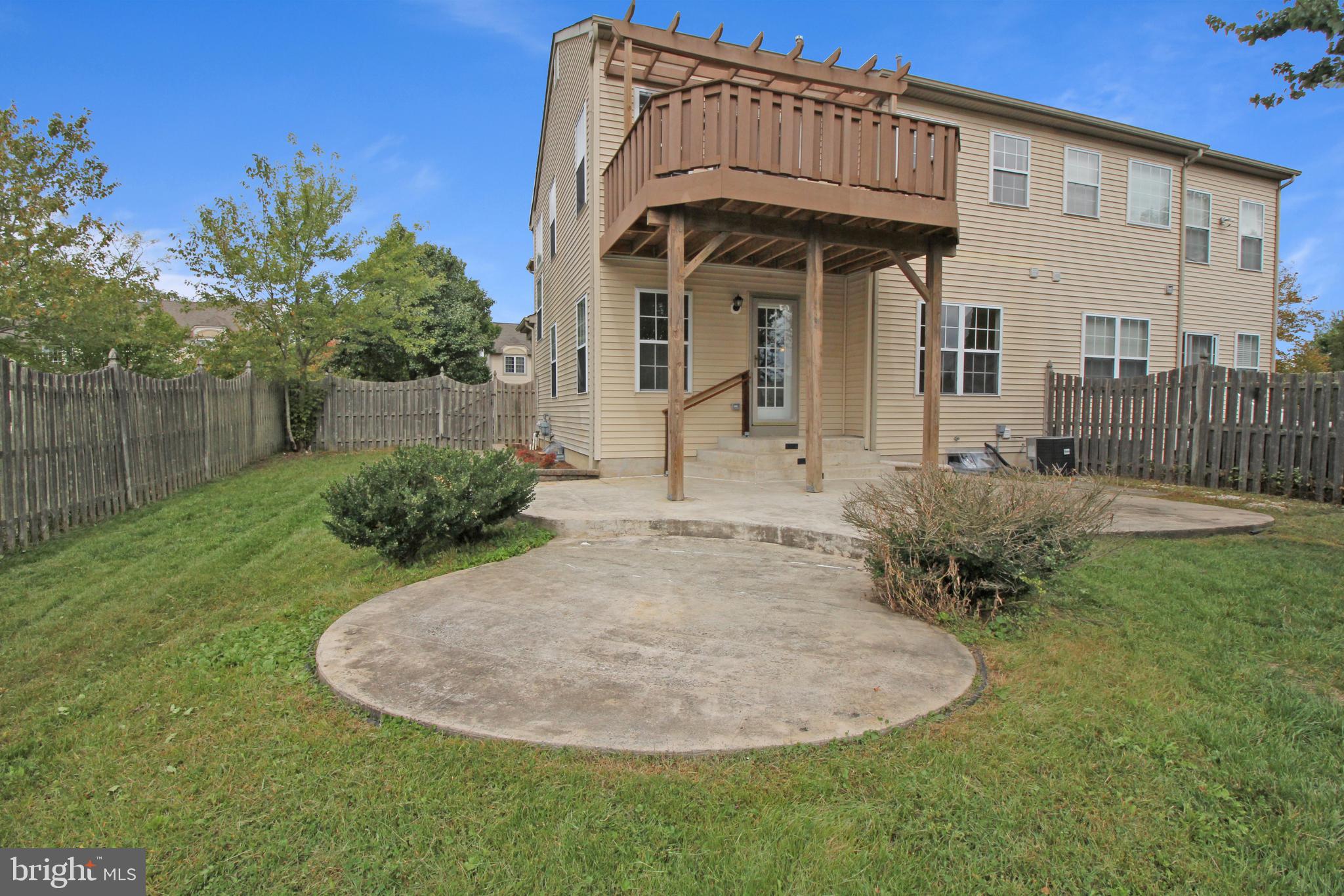 121 Wilson Lane Berlin, NJ 08009 - Photo 58 of 59 a view of a house with a small yard and plants