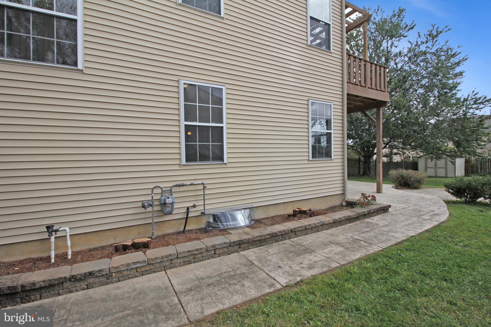 121 Wilson Lane Berlin, NJ 08009 - Photo 59 of 59 a white house with a yard and table and chairs