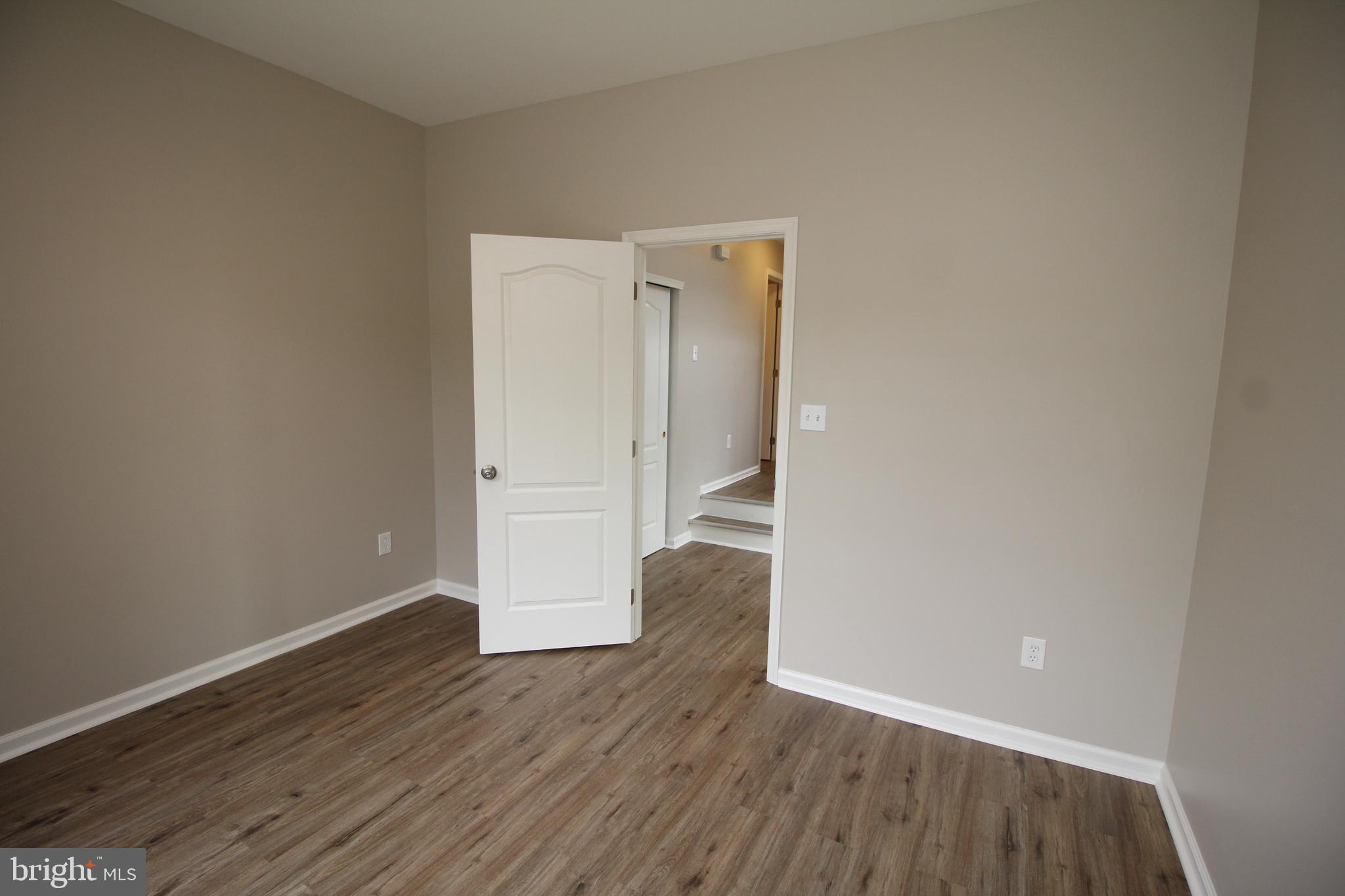 121 Wilson Lane Berlin, NJ 08009 - Photo 8 of 59 a view of an empty room with wooden floor and closet