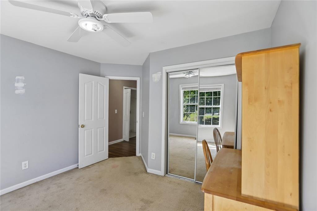 9720 Poole Road Villa Rica, GA 30180 - Photo 20 of 40 a view of a livingroom with a flat screen tv