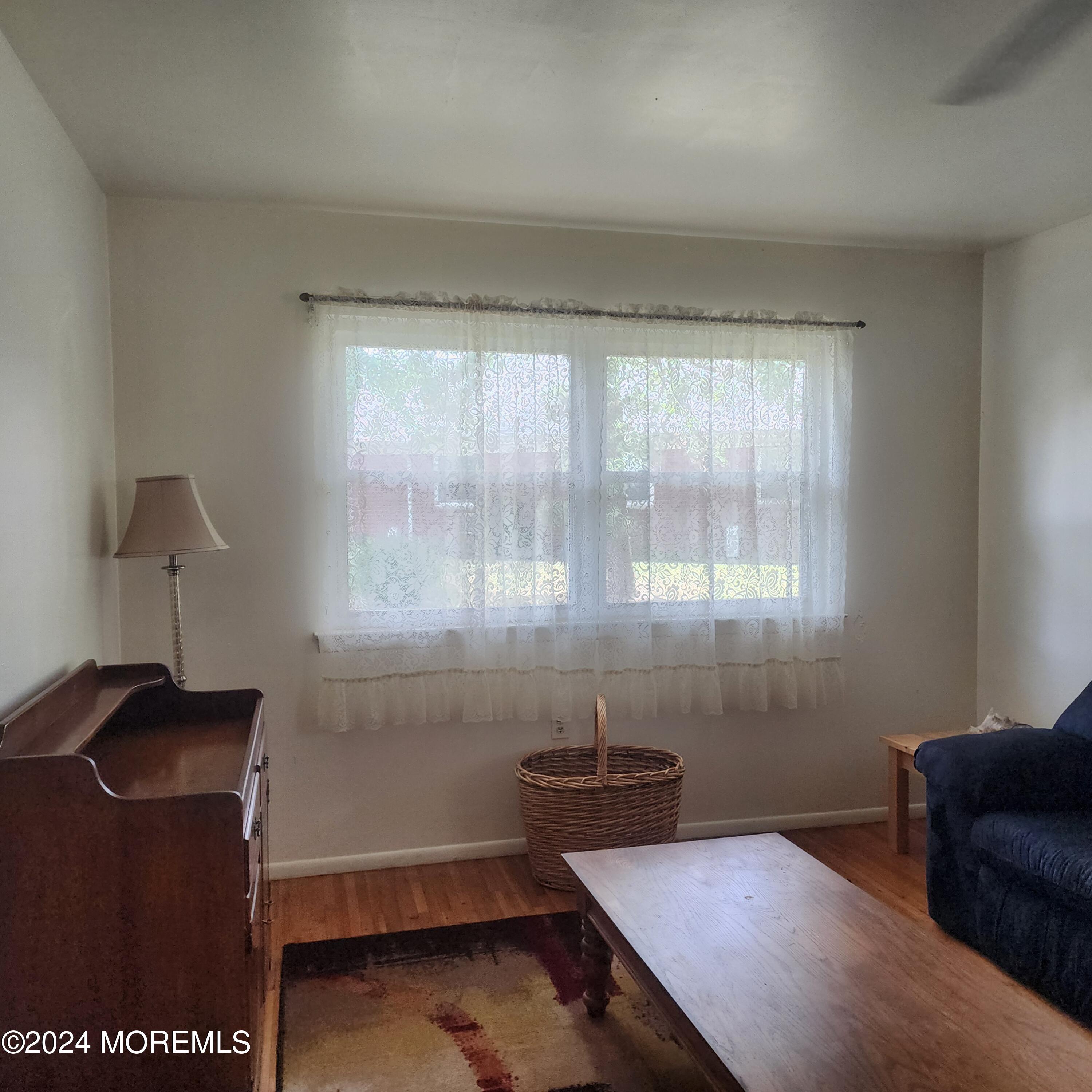 108 Hope Road, Unit D Whiting, NJ 08759 - Photo 11 of 26 a room with furniture and a window