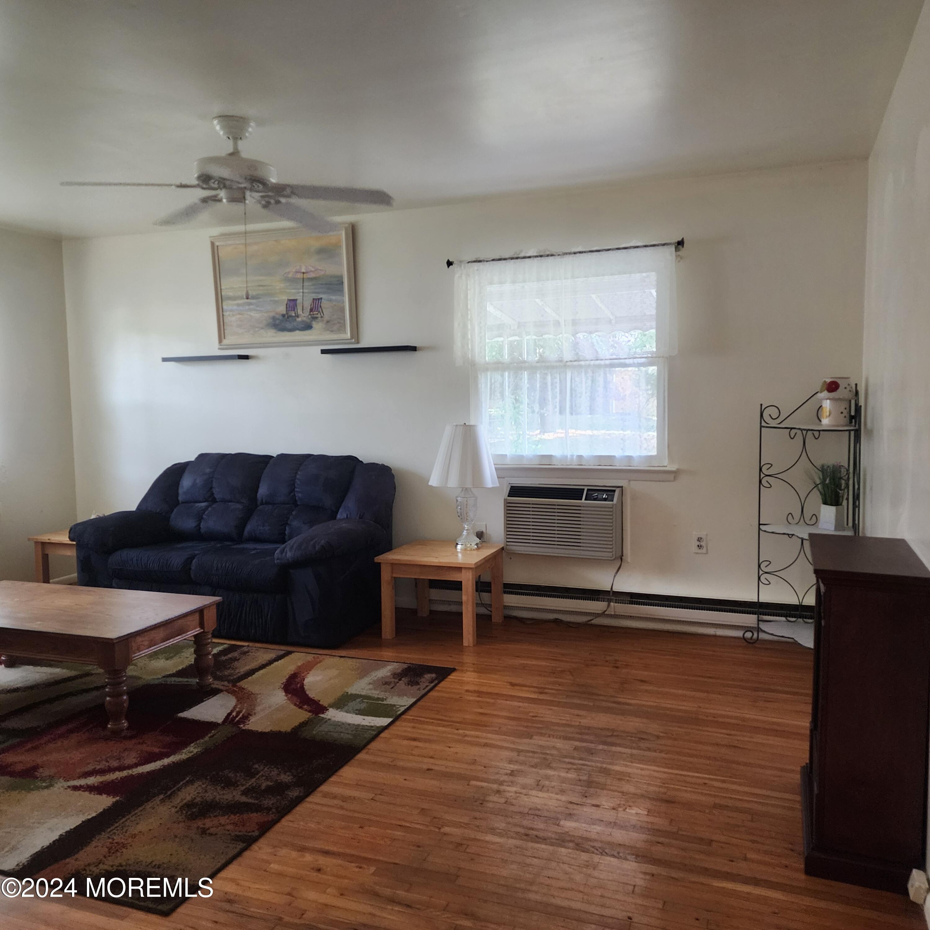 108 Hope Road, Unit D Whiting, NJ 08759 - Photo 12 of 26 a living room with furniture a rug and a window