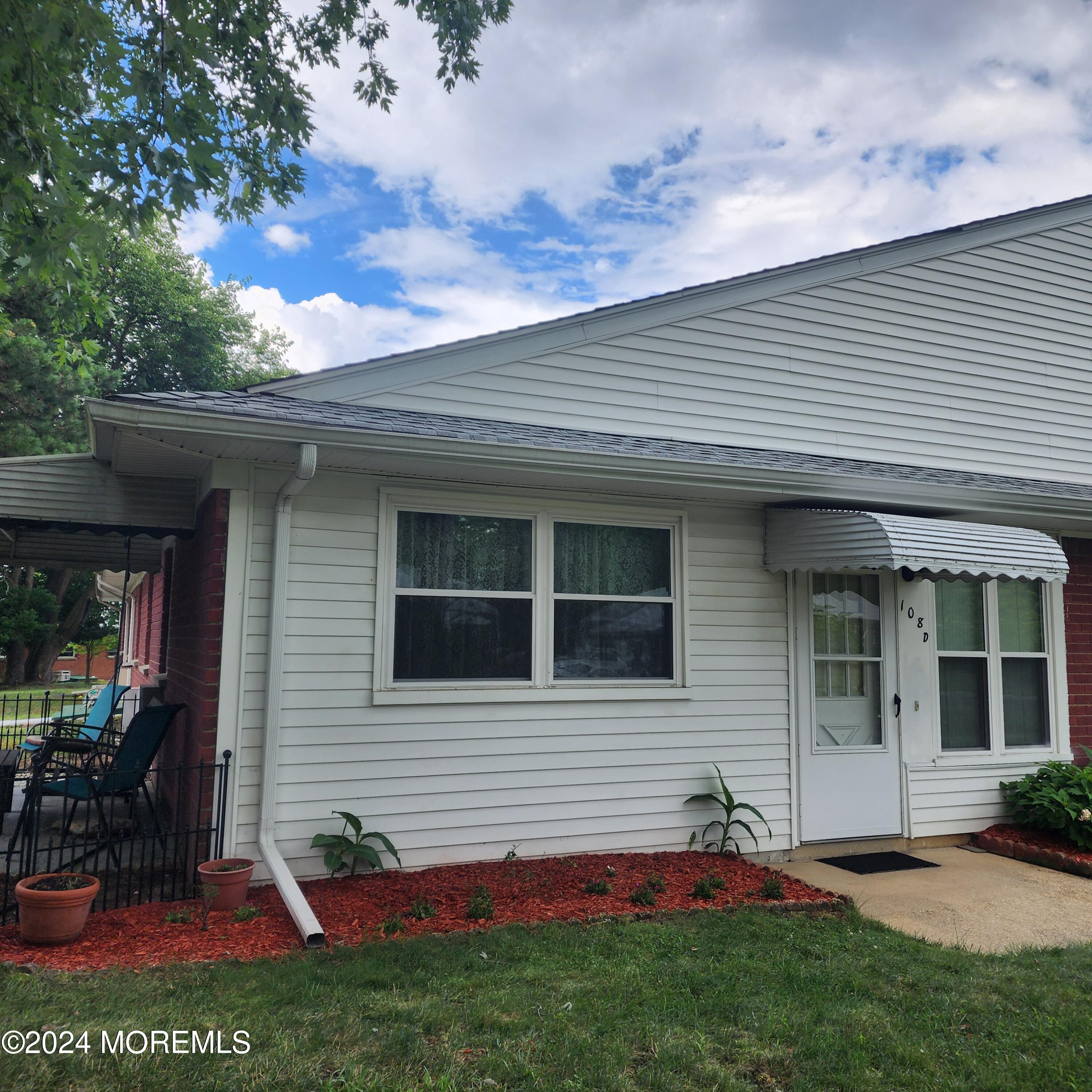 108 Hope Road, Unit D Whiting, NJ 08759 - Photo 2 of 26 a view of a back yard of the house
