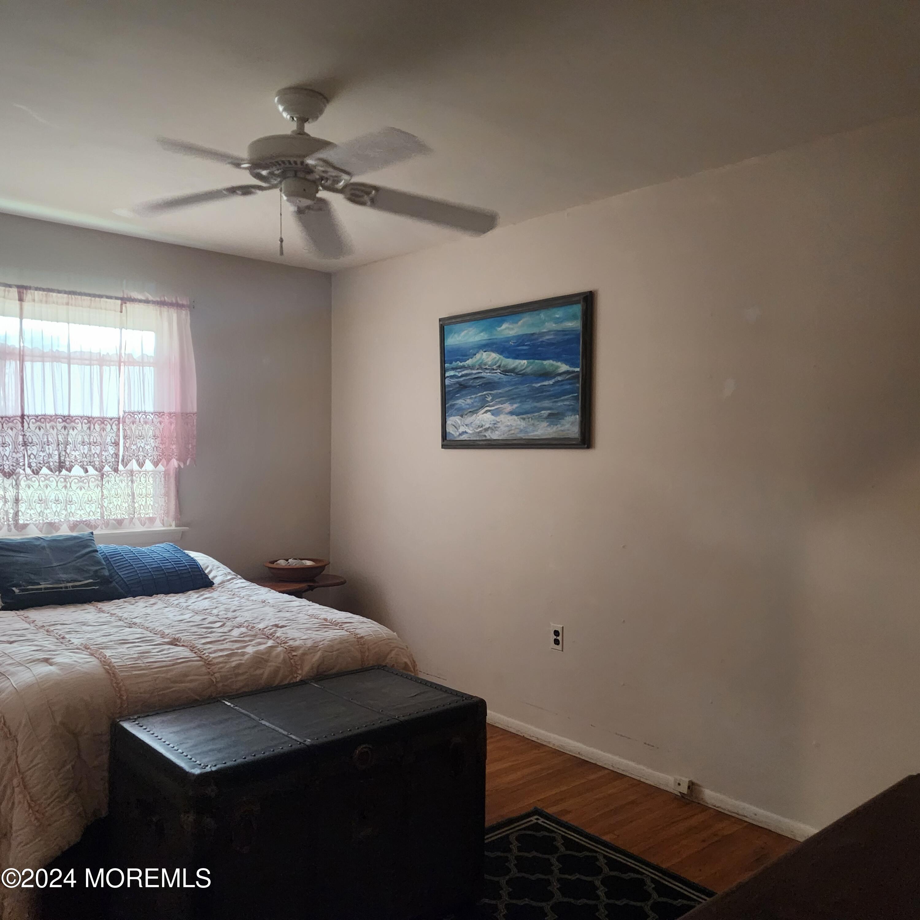 108 Hope Road, Unit D Whiting, NJ 08759 - Photo 21 of 26 a bedroom with a bed and a window