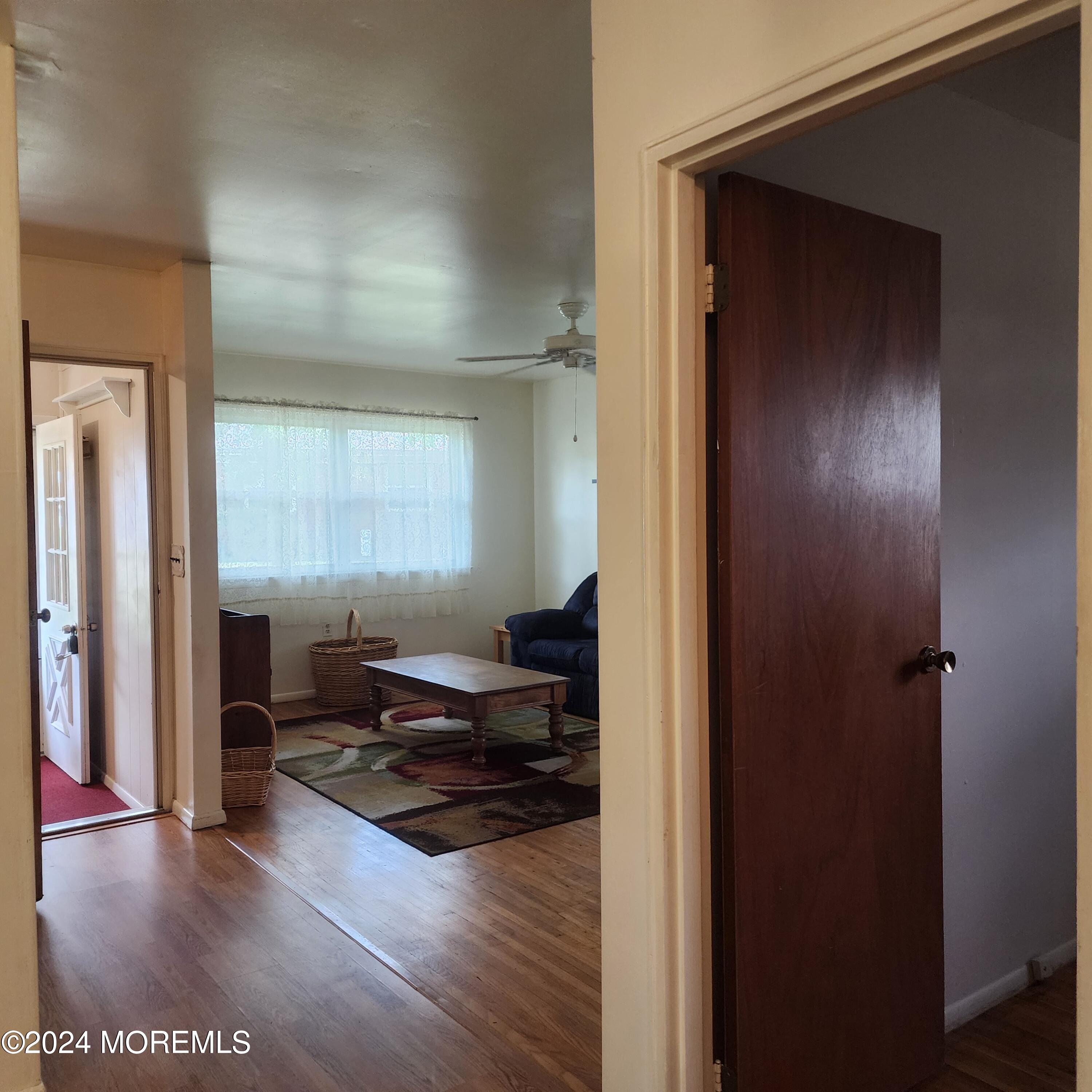 108 Hope Road, Unit D Whiting, NJ 08759 - Photo 24 of 26 a living room with furniture and a wooden floor