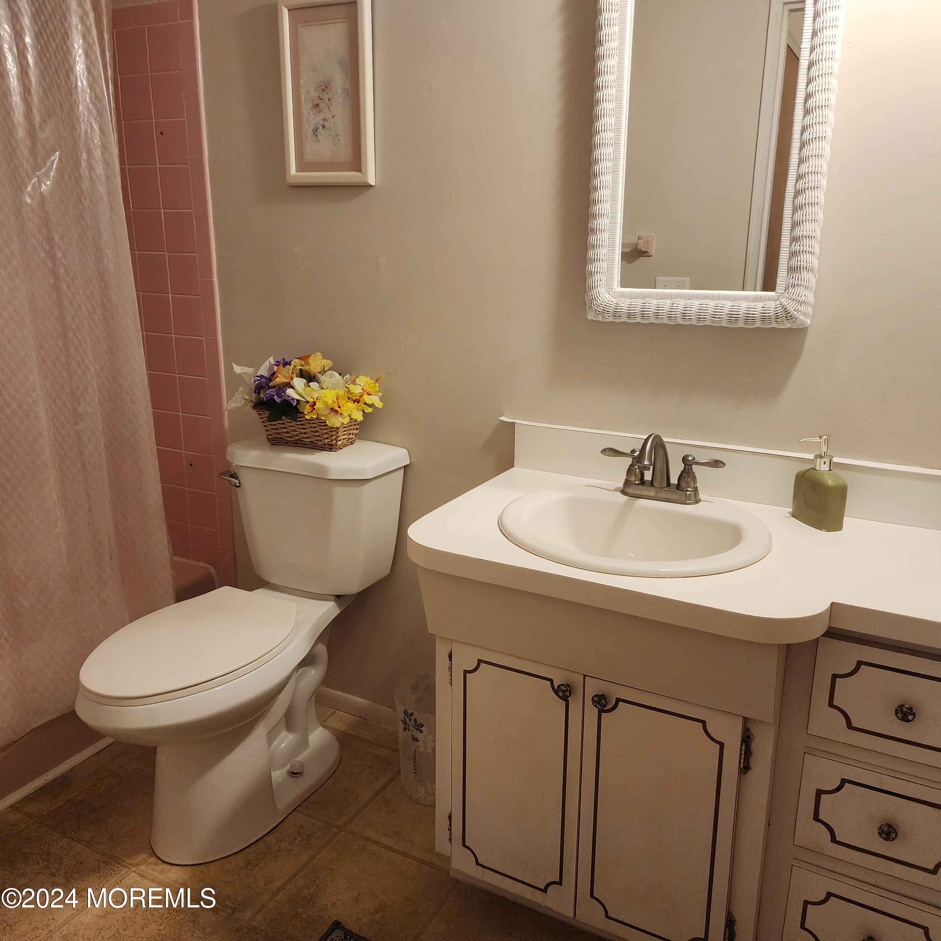 108 Hope Road, Unit D Whiting, NJ 08759 - Photo 25 of 26 a bathroom with a sink toilet and a mirror