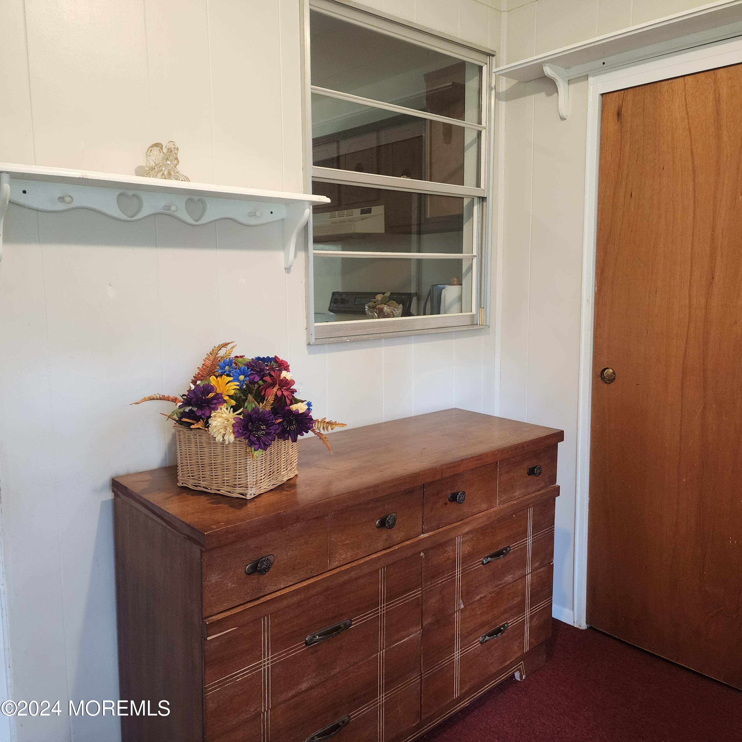 108 Hope Road, Unit D Whiting, NJ 08759 - Photo 7 of 26 a room with a cabinets and wooden floor