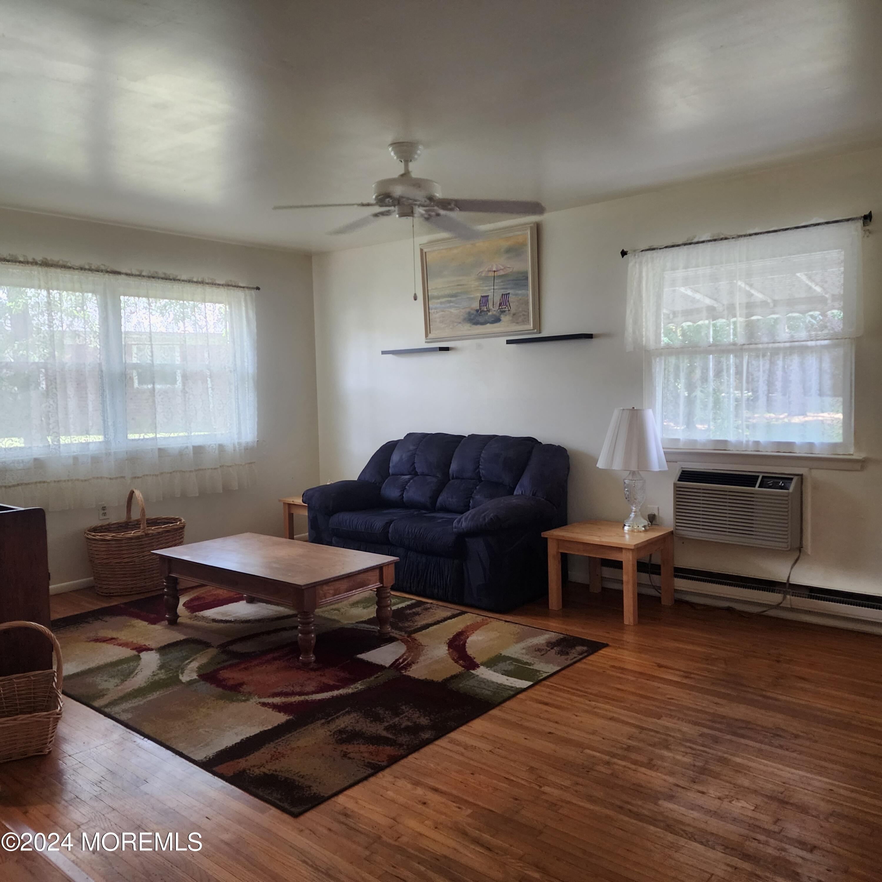 108 Hope Road, Unit D Whiting, NJ 08759 - Photo 10 of 26 a living room with furniture and wooden floor