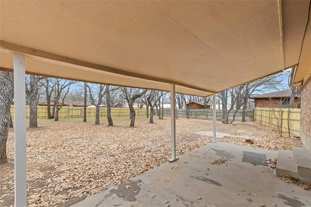 a view of a yard with a house