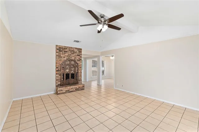 a view of an empty room and window