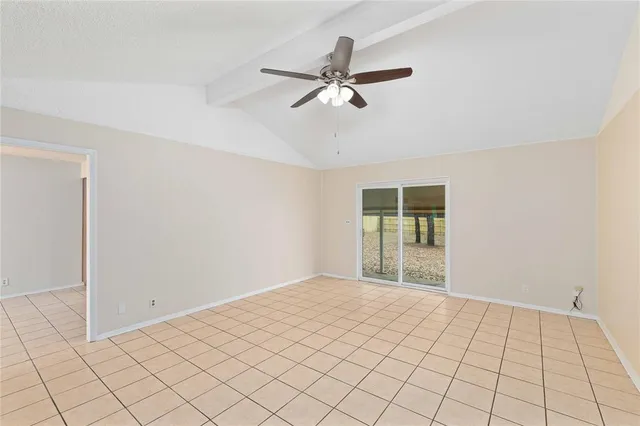a view of an empty room and window