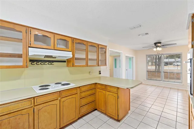 a kitchen with stainless steel appliances granite countertop a sink and cabinets