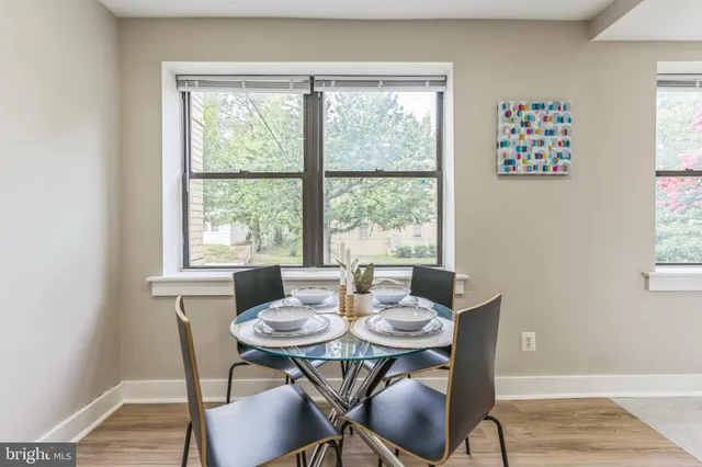 a kitchen with a sink appliances and cabinets