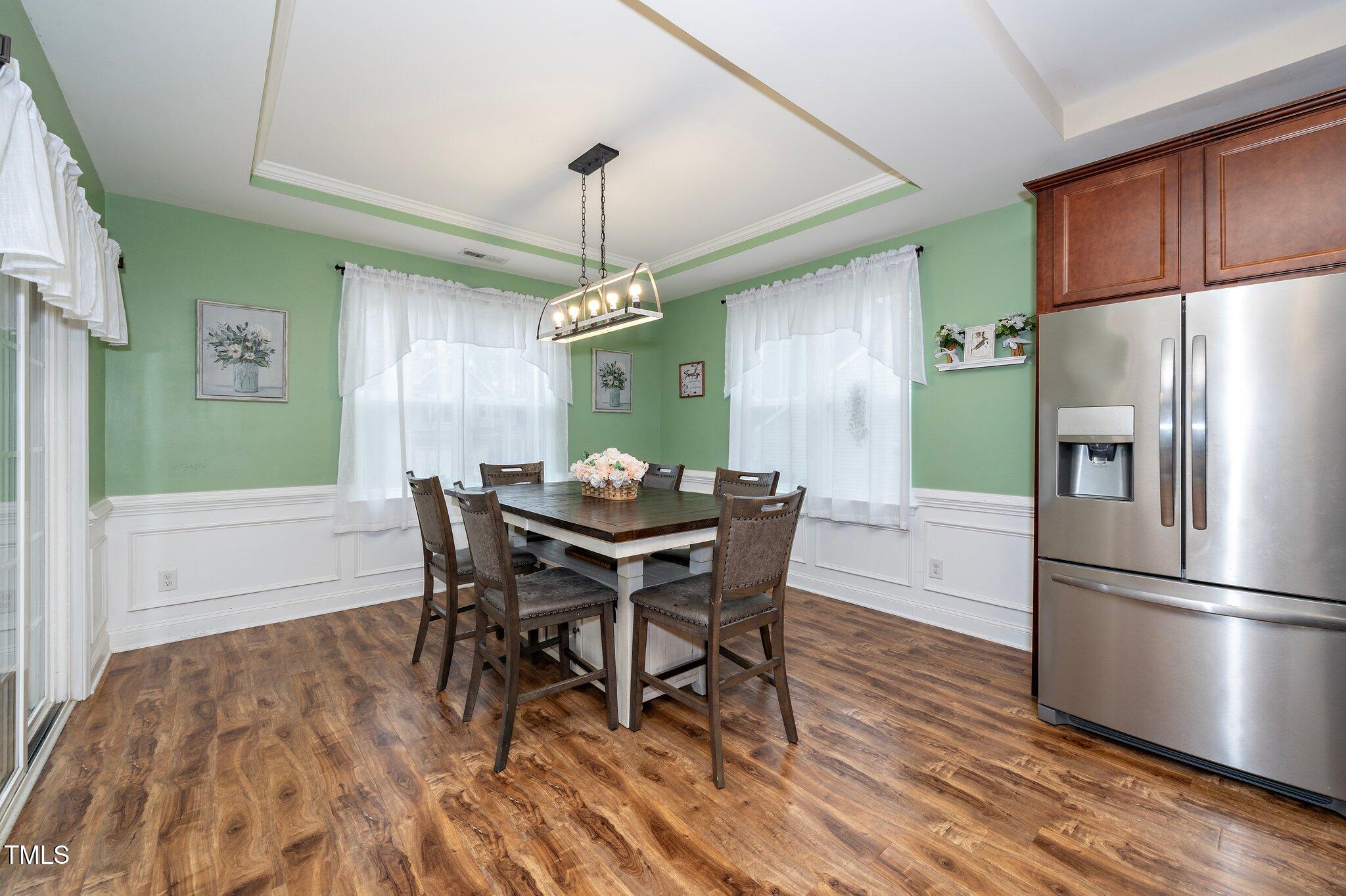 82 Mariners Point Way Garner, NC 27529 - Photo 16 of 30 a view of a dining room with furniture window and wooden floor