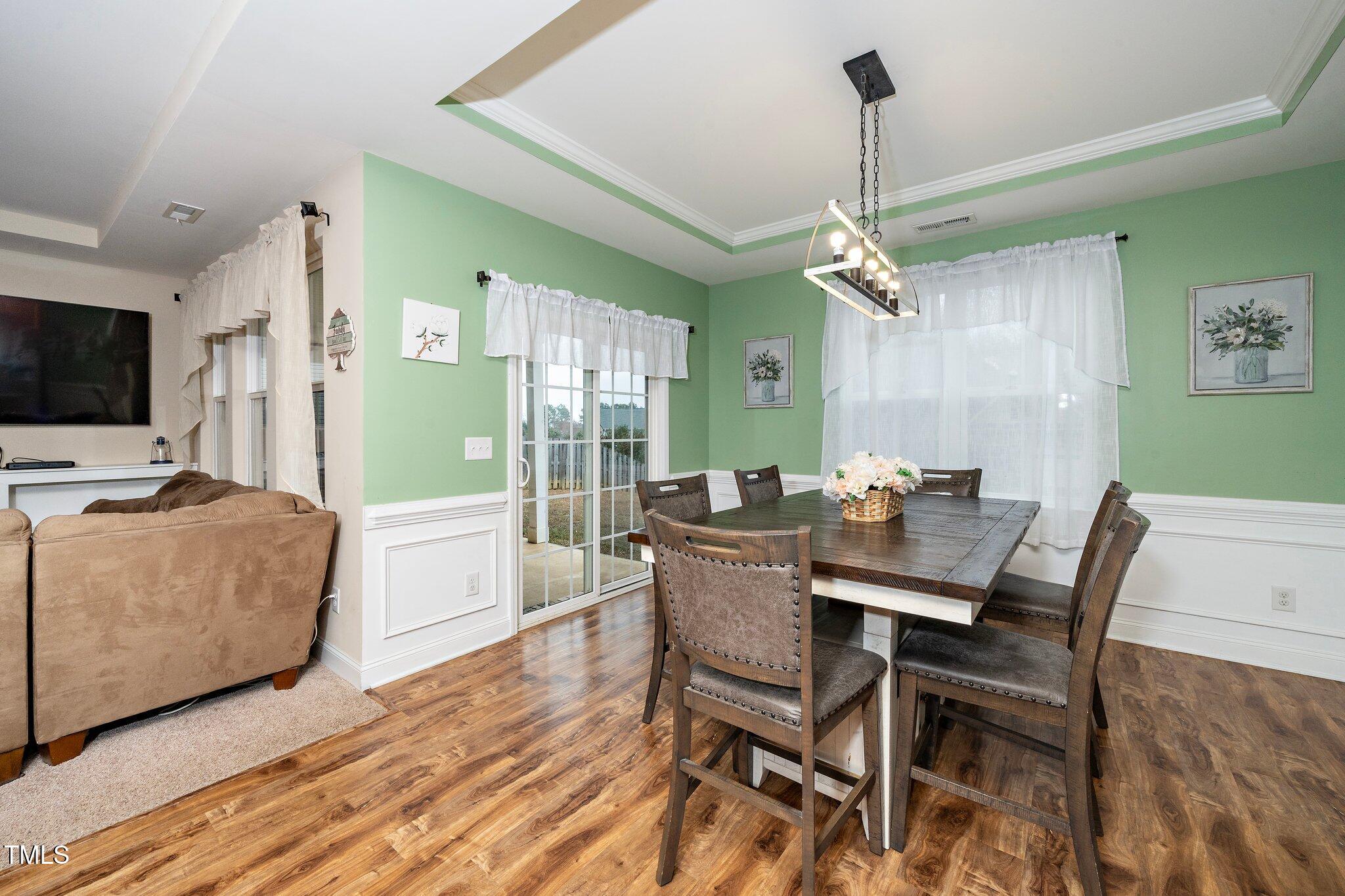 82 Mariners Point Way Garner, NC 27529 - Photo 17 of 30 a view of a dining room with furniture window and wooden floor