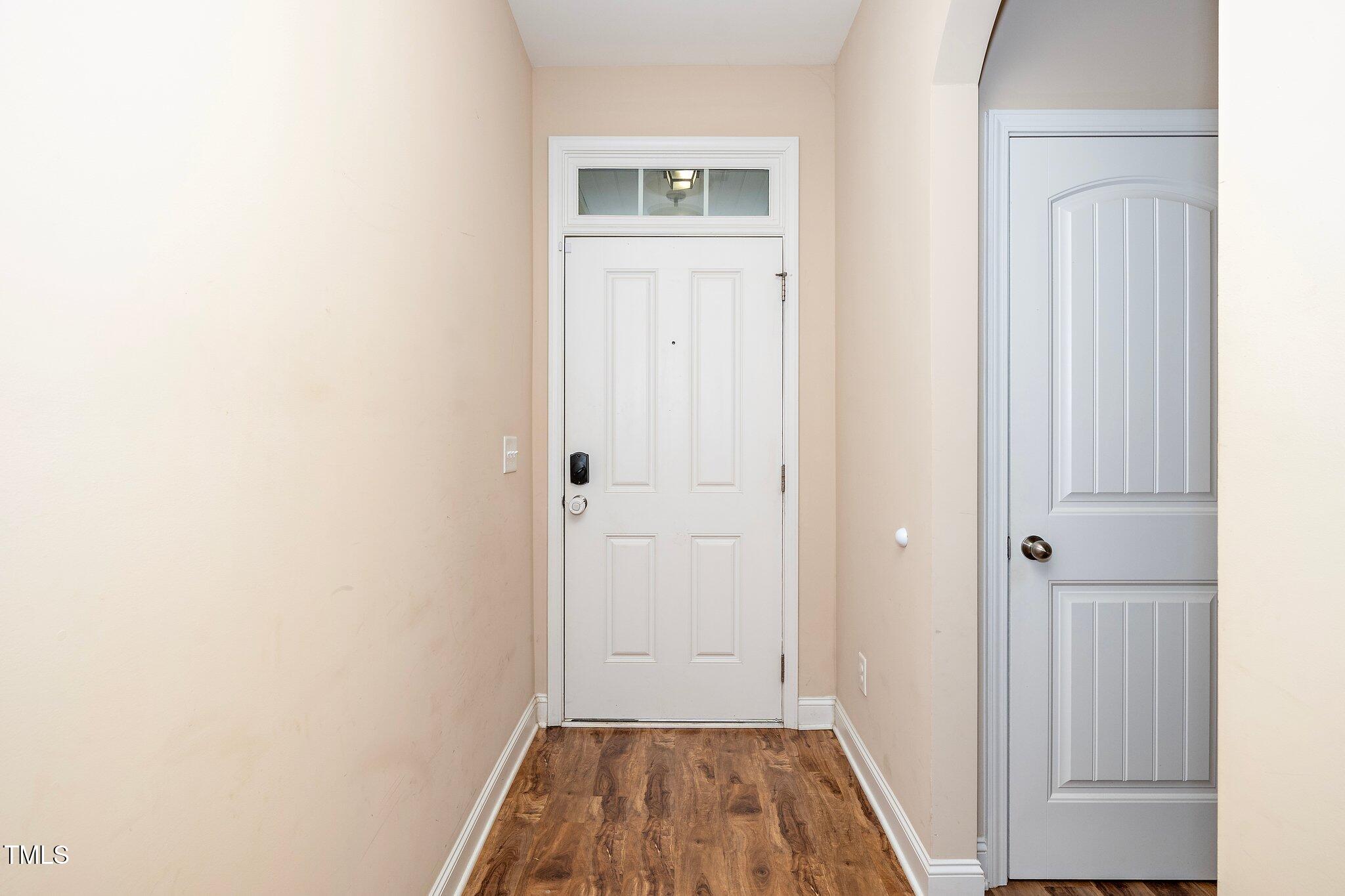 82 Mariners Point Way Garner, NC 27529 - Photo 4 of 30 a view of a hallway with wooden floor