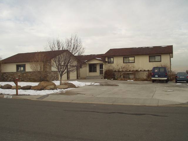 13015 Welcome Reno, NV 89511 - Photo 1 of 8 a front view of a house with a yard