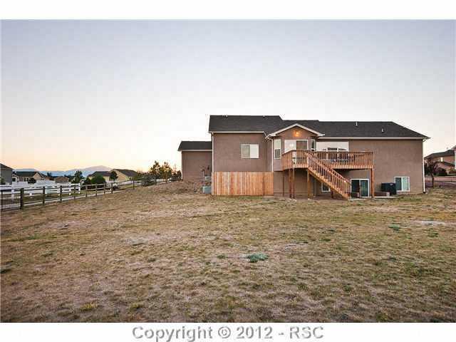 8739 Del Rio Road Peyton, CO 80831 - Photo 23 of 25 Large ½ acre fenced lot w/fenced storage area off the side of the house
