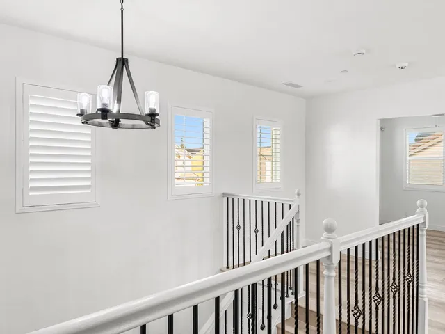 a view of hallway with windows