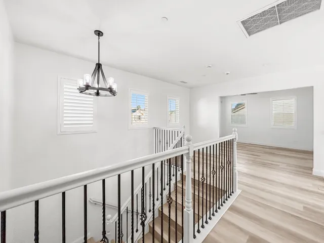 a spacious bathroom with a granite countertop sink a large mirror and a