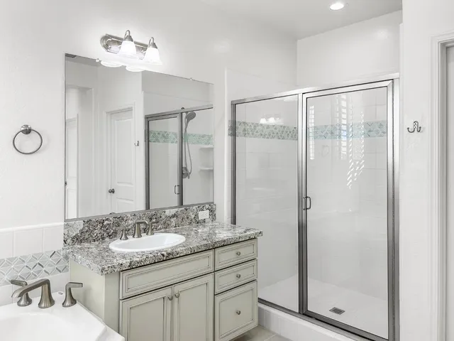 a bathroom with a bathtub and shower