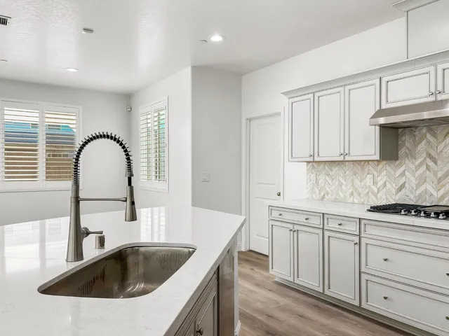 a bathroom with a shower and a sink