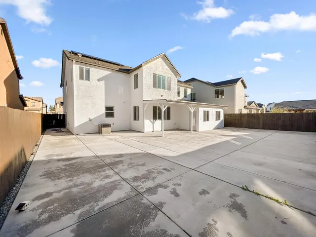 a view of house with yard