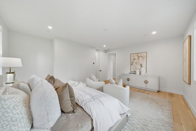 a spacious bathroom with a bathtub and shower