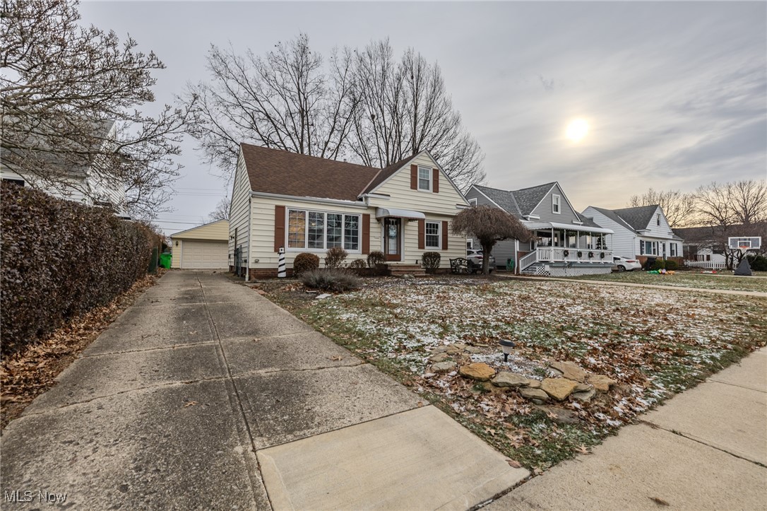 765 Pendley Road Willowick, OH 44095 - Photo 6 of 50 View of front of property featuring a garage and an outbuilding