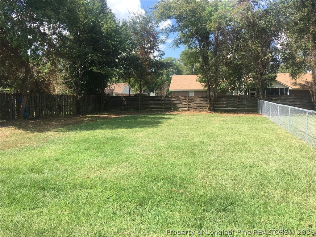 115 Eulon Loop, Unit A Raeford, NC 28376 - Photo 16 of 16 a backyard of a house with lots of green space