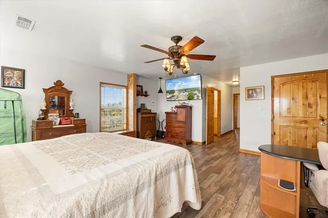 a bed room with a bed and a chandelier