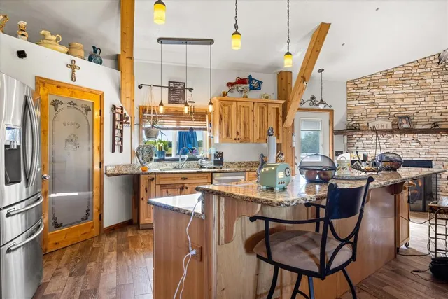 a kitchen with lots of counter top space and stainless steel appliances
