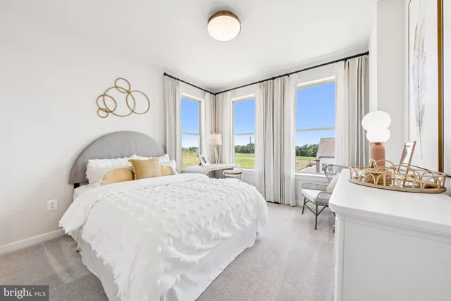 a bedroom with a bed and a table