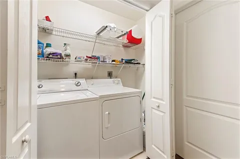 a storage room with washer and dryer