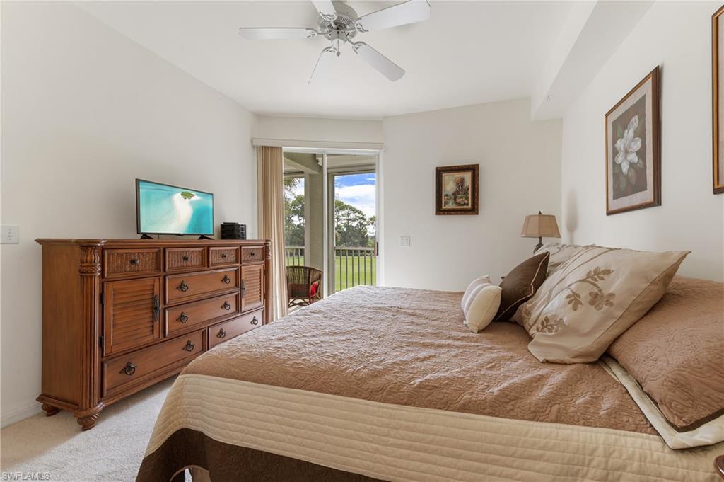 9300 Highland Woods Boulevard, Unit 3206 Bonita Springs, FL 34135 - Photo 14 of 25 a bedroom with a bed and a dresser