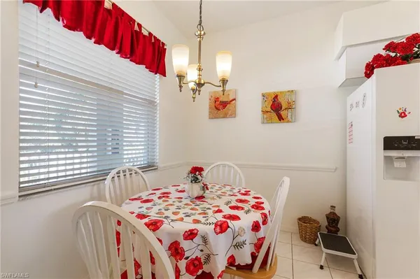 a bedroom with a bed dresser and a window