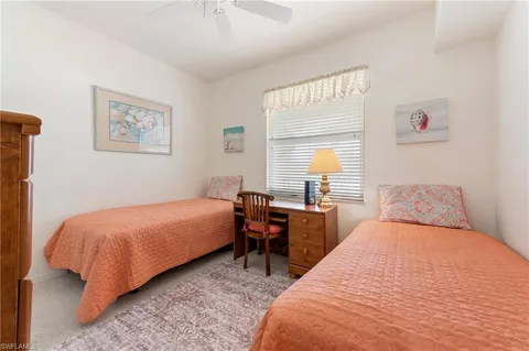 a bedroom with a bed and a table in it