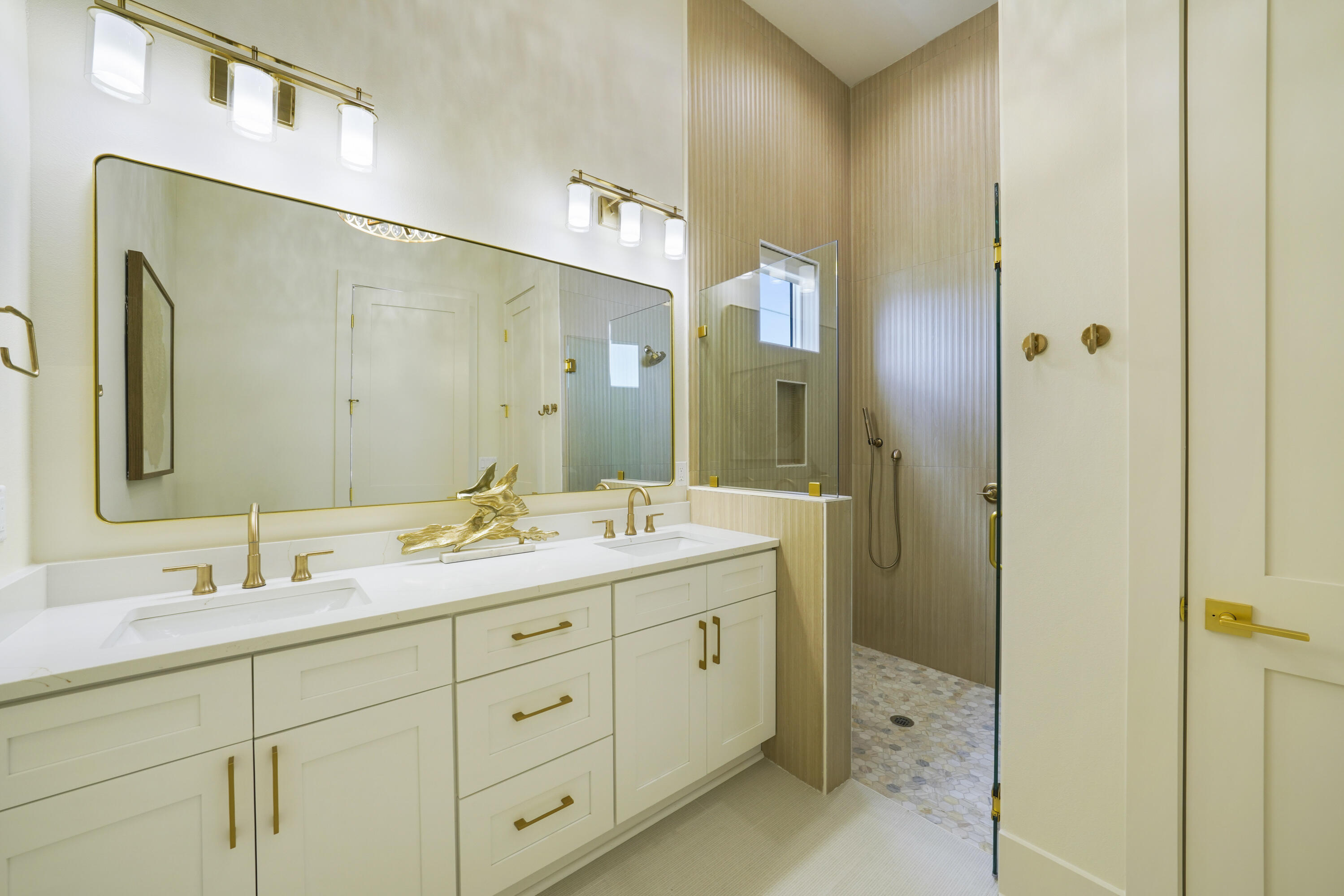 56 Sea Croft Cove Santa Rosa Beach, FL 32459 - Photo 38 of 65 a bathroom with a double vanity sink and a mirror