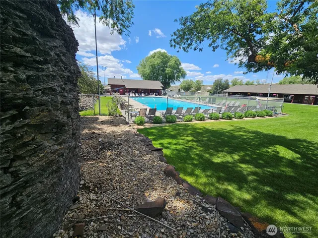 a view of a large building with a mountain in the background